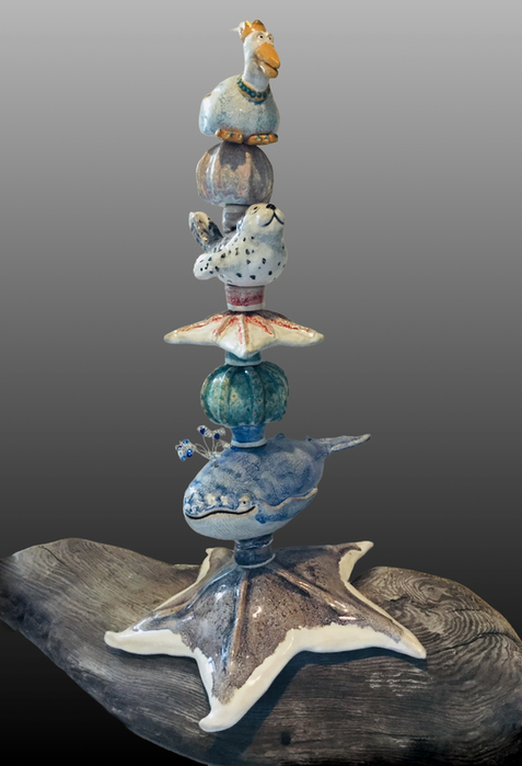 Stacked totem with sea creatures and pottery ceramics; aquatic themed