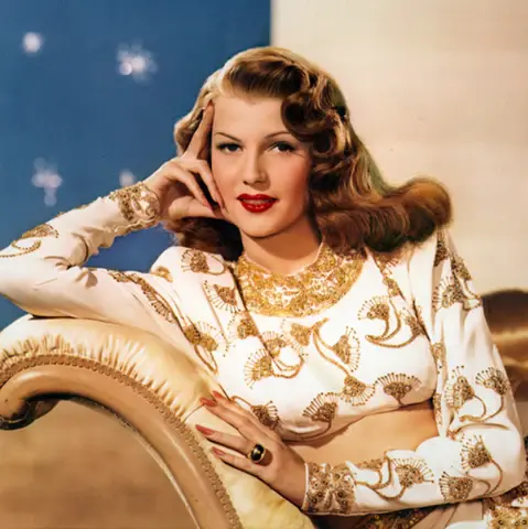 a 1940s lady wearing vintage jewellery