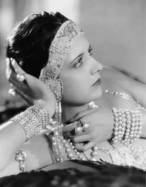 a 1930s flapper girl wearing vintage jewellery