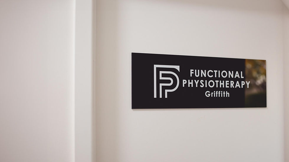Logo sign of Functional Physiotherapy Griffith mounted on a white wall, featuring a bold FP initials in white on a black background with the full physio clinic name in white lettering