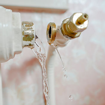 Photo of water gushing out of a broken pipe