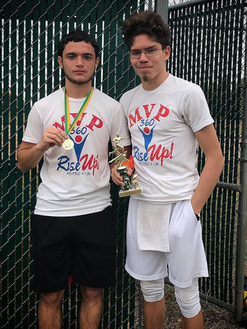 Two young men wearing MVP Rise Up shirts with medal and trophy MVP360 Sports.