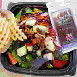 French fries a salad and light balsamic from Chick-Fil-A.