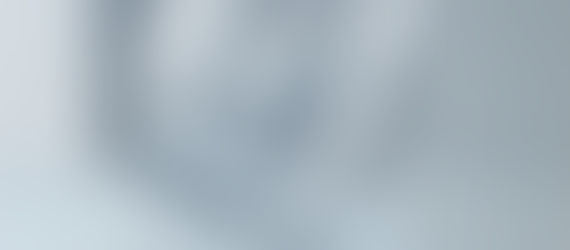 A minimalist editorial illustration shows a white paper boat floating level inside a tilted clear glass that teeters at the edge of a white table. The cool gray setting is calm and elegant, but the unstable composition suggests balance preserved in the midst of imminent risk.