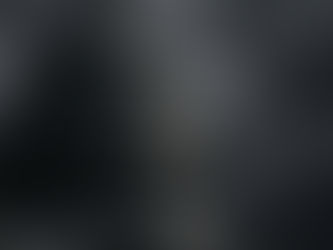 The United States Capitol dome in dramatic shadow under storm clouds, symbolizing institutional strain in American democracy.