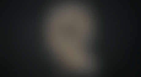 Abstract image of a human head formed from scattered paper fragments, blurred photographs, and handwritten notes, connected by glowing lines and points of light against a dark background, suggesting continuity of self despite incomplete memory.