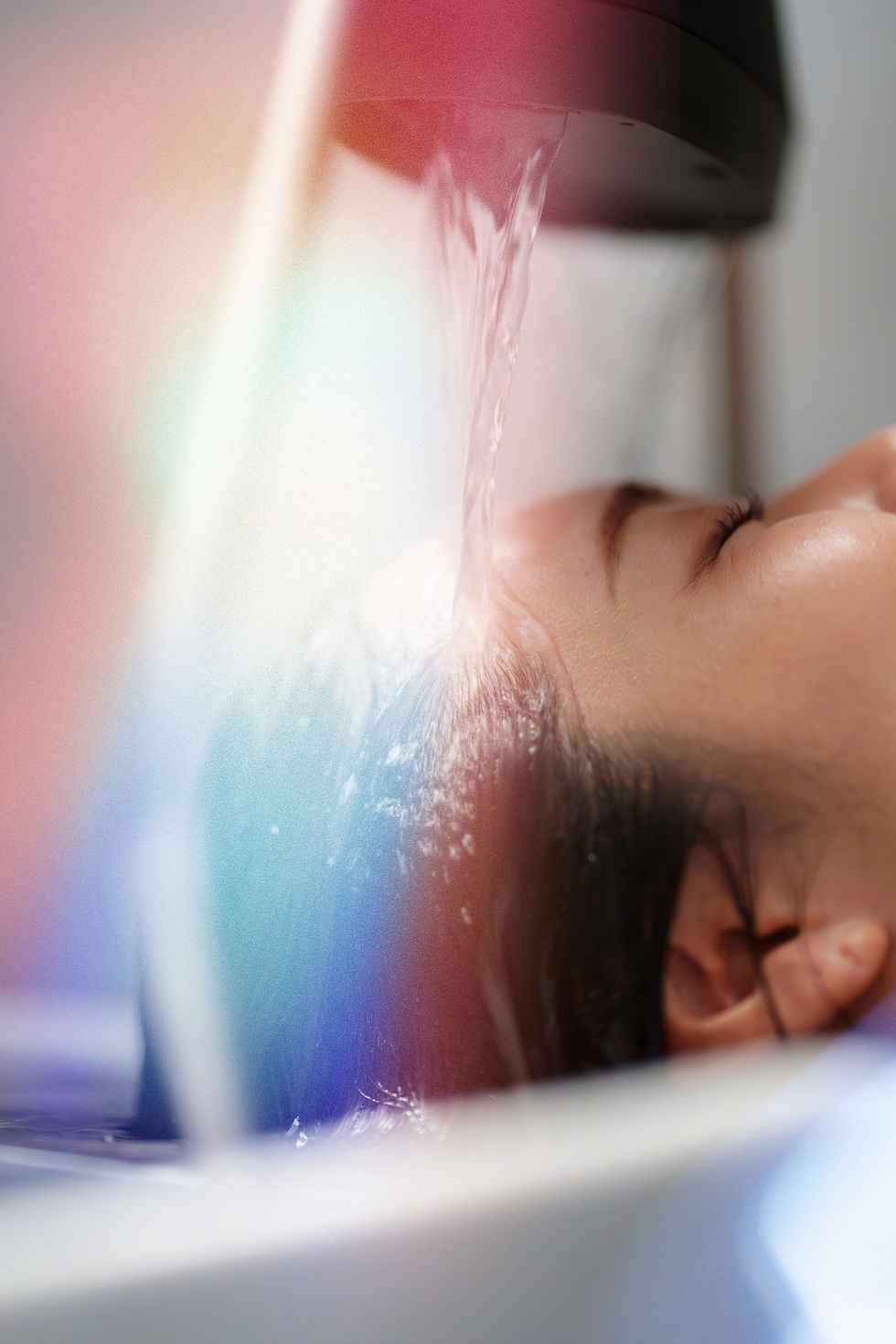 A relaxing waterfall rinse during a luxury head spa and hair repair treatment at Edge + Aura salon in Valparaiso, Indiana.