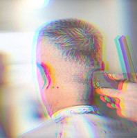 Rear view of a clean, short clipper cut and modern hair fade at Edge and Aura in Valparaiso.
