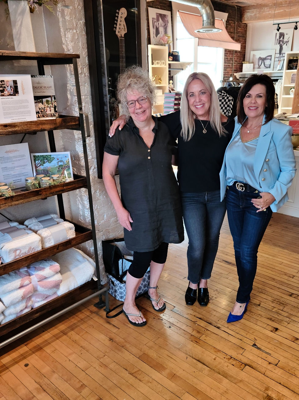 3 women standing next to retail display
