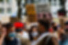 Public gathering of people wearing facial masks while protesting for justice and rights