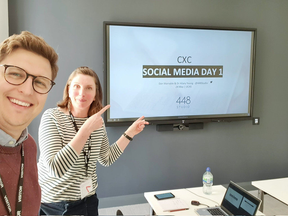 Hilary points at slides as Dan takes a selfie