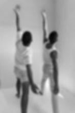 Yoga teacher intructing student