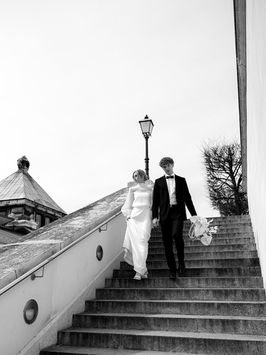Bride and groom hugging during their intimate outdoor wedding ceremony