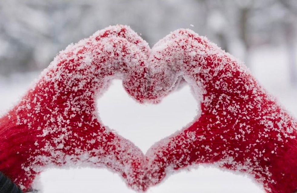 Hands forming a heart in the snow – symbol of love, service, and open heart to God