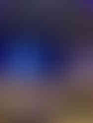 Women gathered for a fall-themed dinner event at Crosswater Community Church, sitting at decorated tables under warm hanging lights.