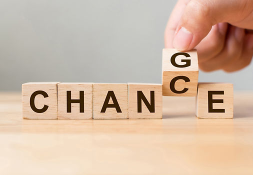 Hand flip wooden cube with word change to chance, Personal development and career growth o