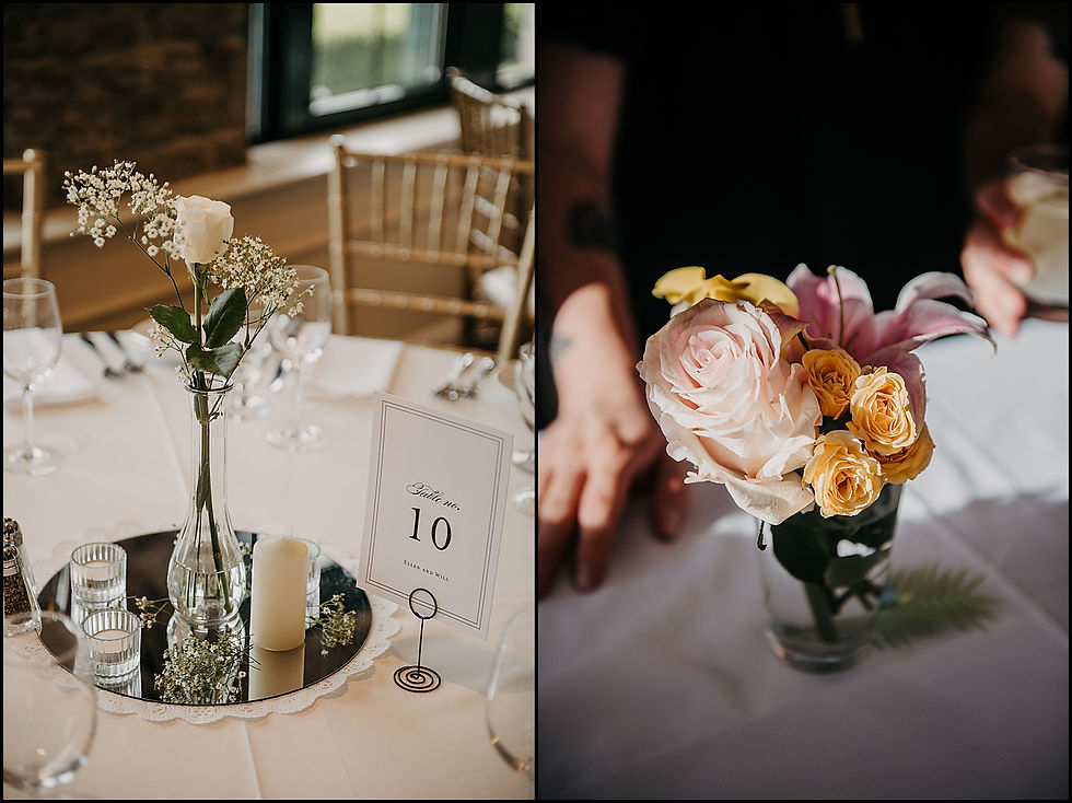 A rose and baby's breath sit in a small vase on a wedding reception table for classic wedding decor in Buffalo.