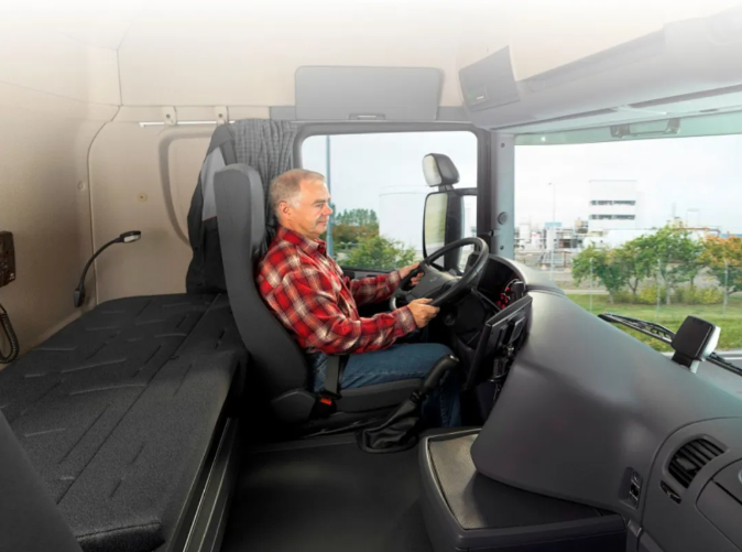 Fig 1. A driver on the truck with parking AC.