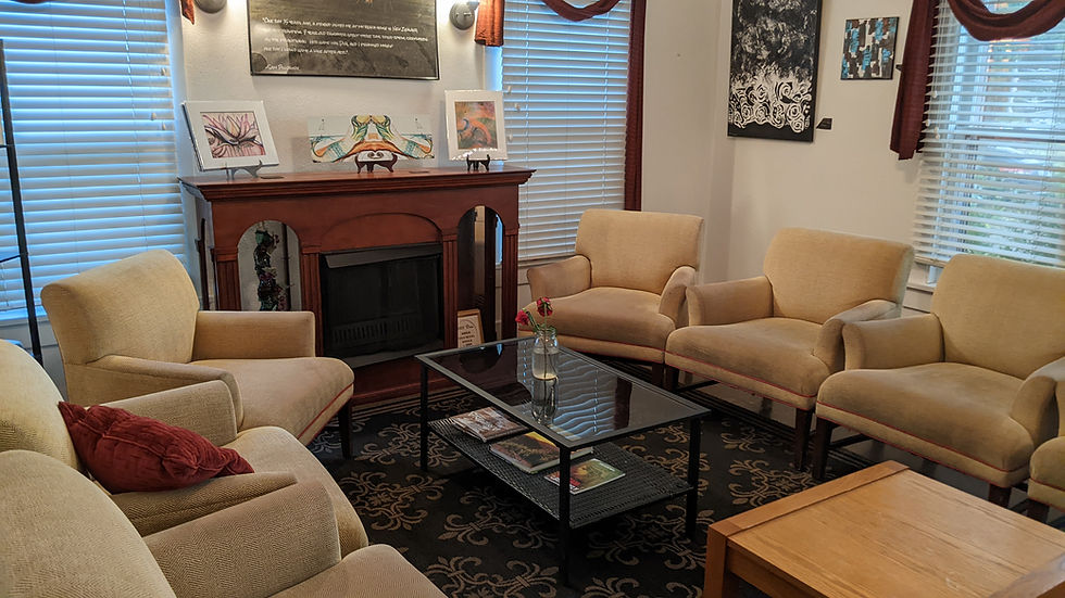 Several soft chairs line the old-fashioned room, forming an intimate space for conversation.