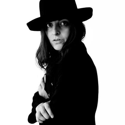 Elegant black and white senior portrait of a girl in a felt hat, part of an artistic session in Phoenix, AZ