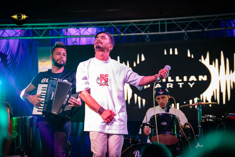 An enthusiastic live performance captures the essence of Brazilian rhythm, electrifying the crowd at a cultural festivity