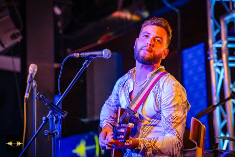 A couple showcases a sensual Latin dance, embodying the passion of our Brazilian party scene.