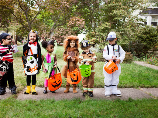 Portrait of children (2-3, 4-5) wearing costumes on Halloween