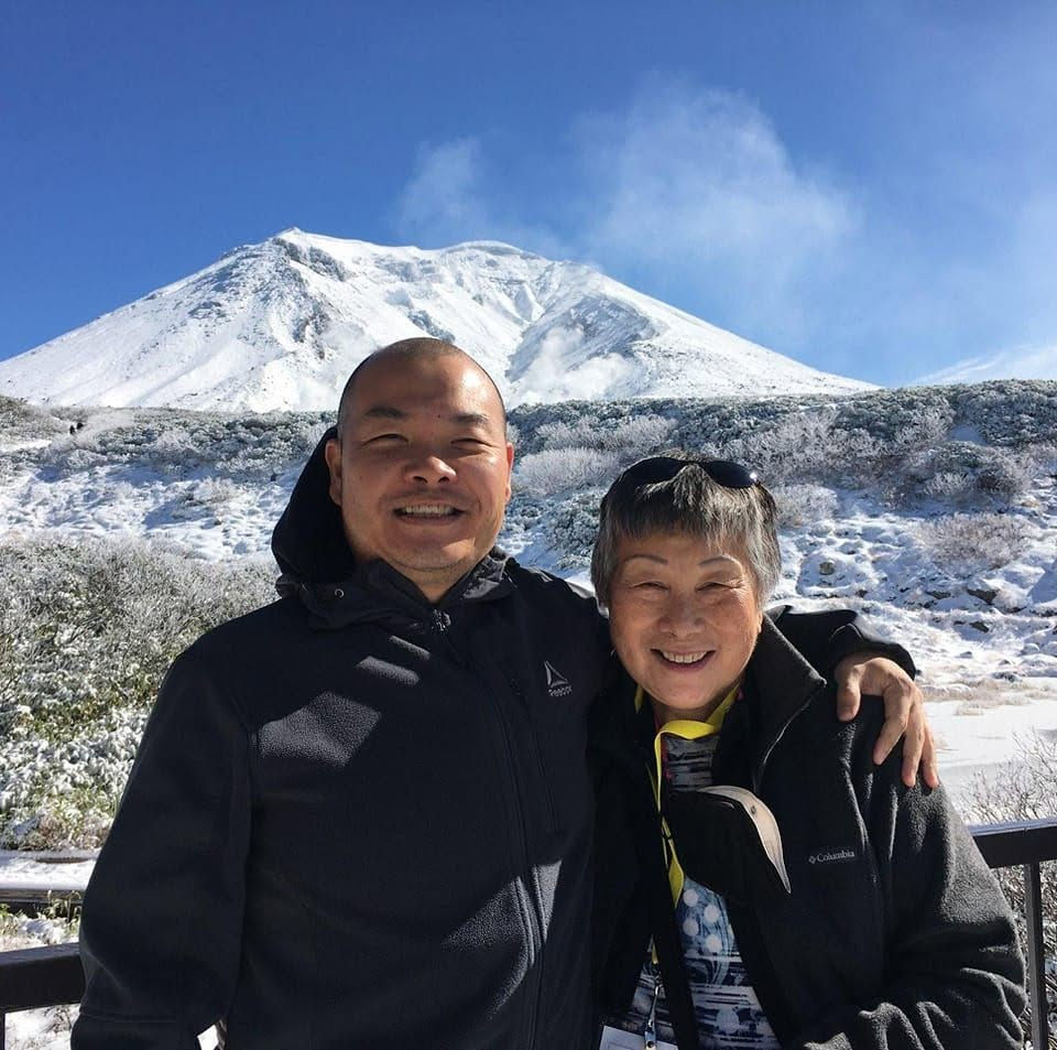 A photo of Kent and his mom in front of Mt. Asahi. Hokkaido, Japan