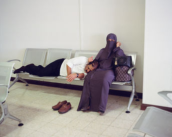 A Muslim couple resting in the Malé Airport.