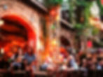 A lively evening at a ruin bar in Budapest, with groups of people enjoying drinks and conversations under colorful lights and rustic decor.