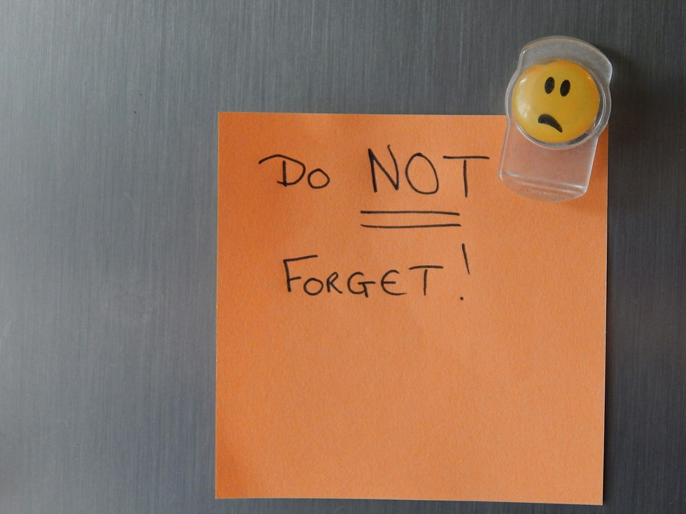 Orange sticky note on a fridge that reads “Do Not Forget,” illustrating reminder timing for a stag party invitation.