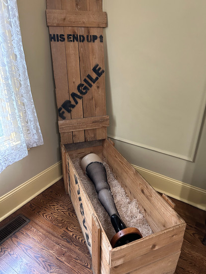 Replica leg lamp in wooden crate