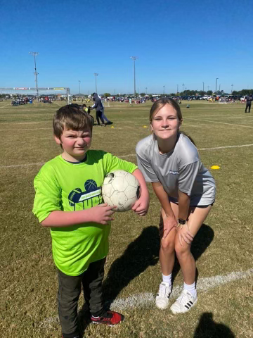 Boy with coach at Buddy Ball