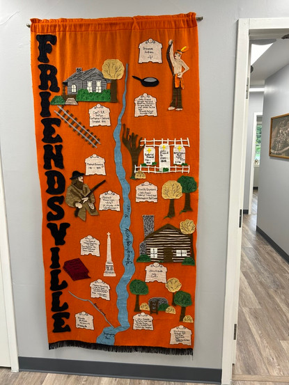 Fabric banner depicting the history of Friendsville, Maryland