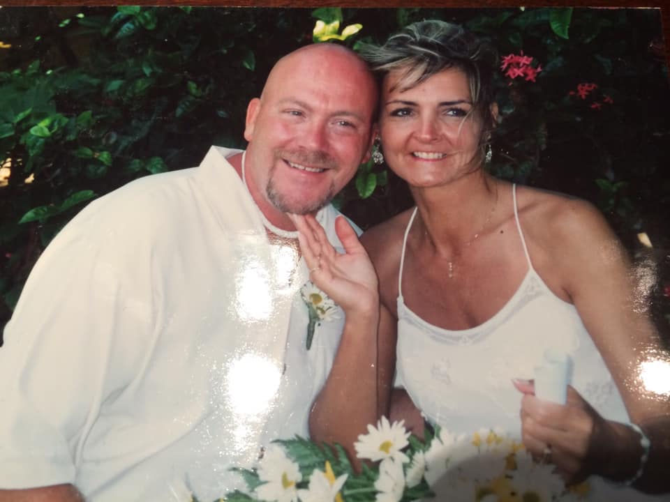 Photo of husband and wife at their destination wedding.