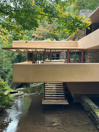 View of the steps leading down to the water at the top of the waterfall, over which the Fallingwater house is built