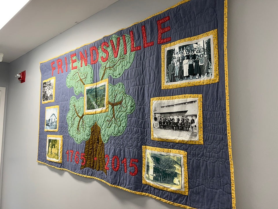 An historical quilt in a town hall building.