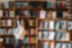 English student choosing books in library