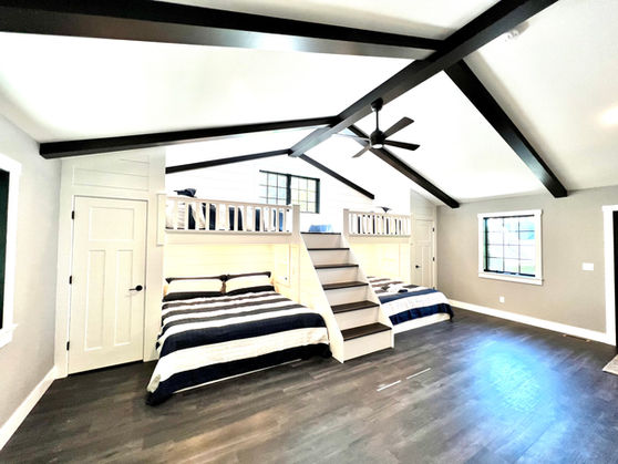Custom built-in bunk beds with integrated stairs