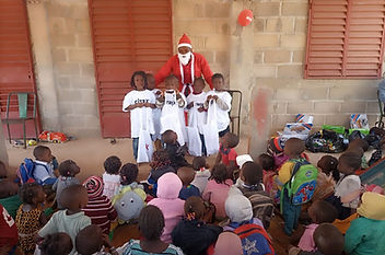 SCF Christmas Party - SCF Santa with children - Burkina Faso _edited.jpg
