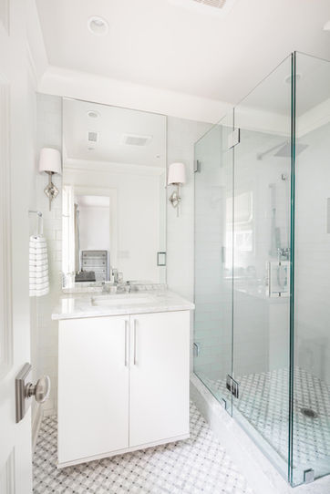 Walk in glass shower and single vanity