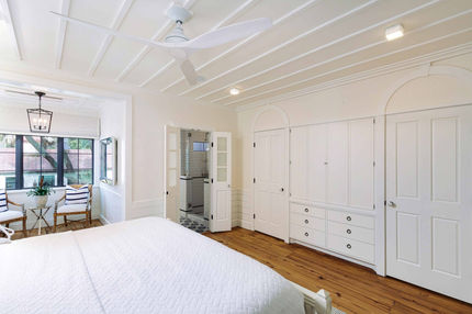 Large white bedroom with built-ins