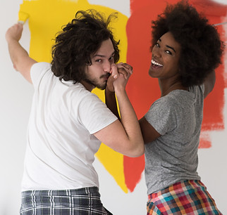 vecteezy_multiethnic-couple-painting-interior-wall_11259757.jpg