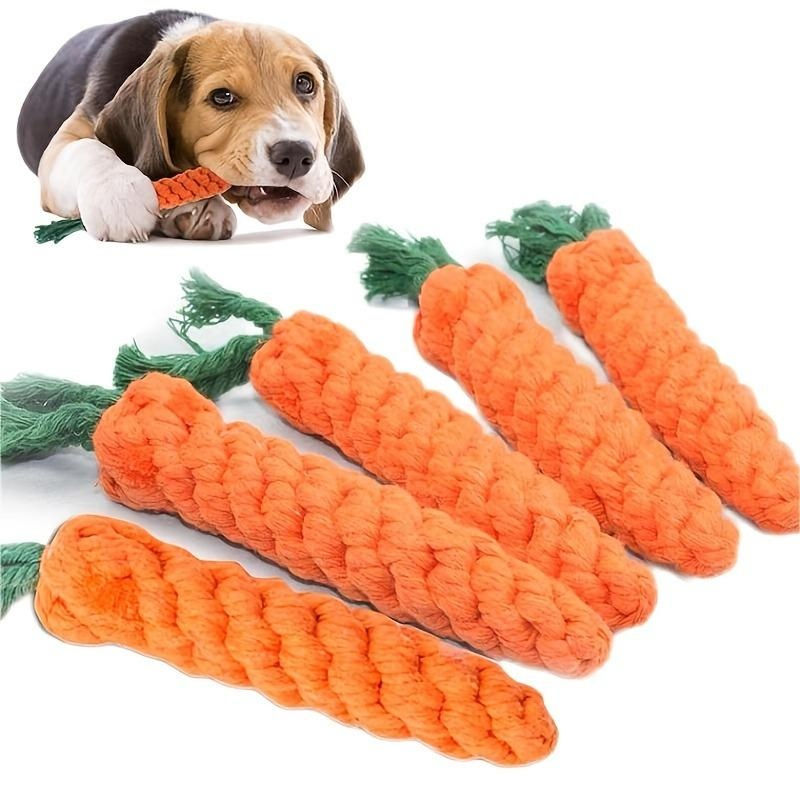 Beagle puppy chewing on a carrot-shaped cotton rope pet toy
