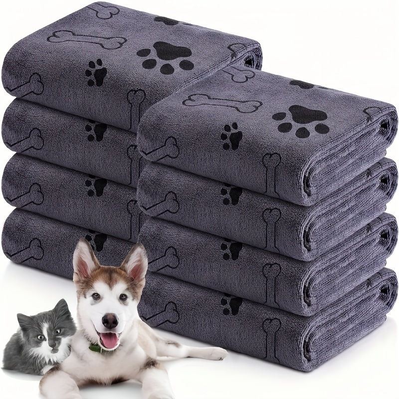 Thumbnail: Stack of microfiber dog towels with paw and bone prints.