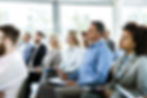 Picture of people listening to a lecture
