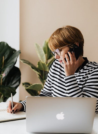 Woman representing a TFG Case Manager answers the phone
