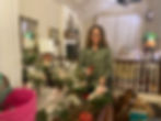 TFG support volunteer arranging bouquets for Valentine's Day to give to participant moms