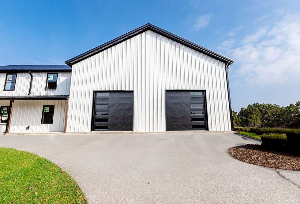 Black commercial garage doors on a metal building