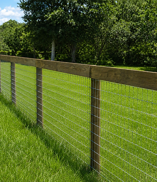 Farm and ranch wire fence with wood posts on a green Florida pasture — installed by Penrod Lumber & Fence in Marion County